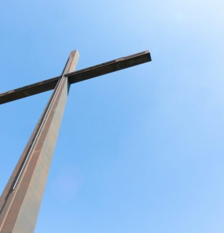 Big metal cross and a clear sky -the concept of religion